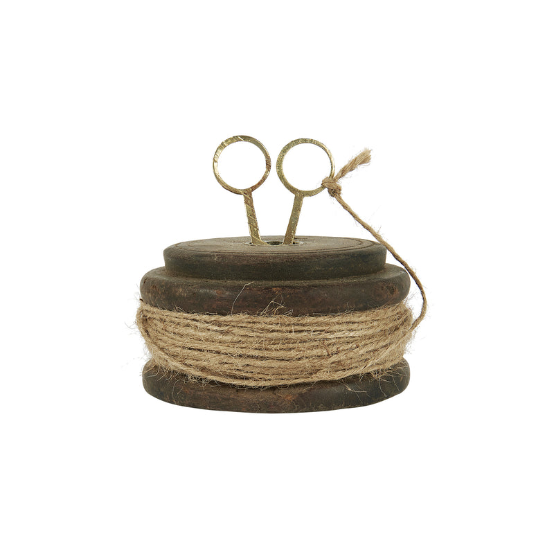 Wooden spool with string and scissors
